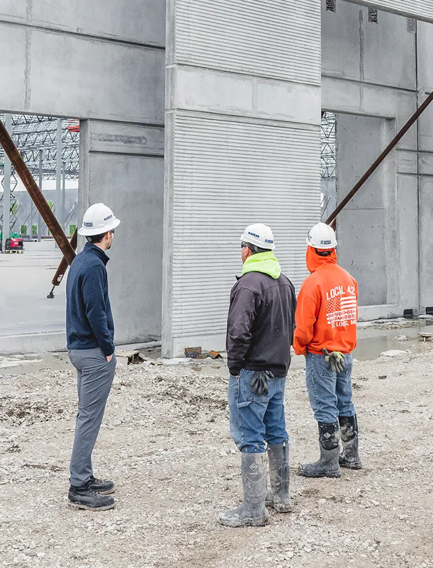 Three men on construction site